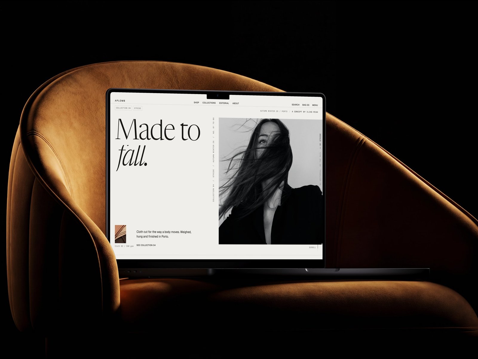 The Aplomb home page open on a laptop resting in a tan leather chair, the display serif reading Made to fall