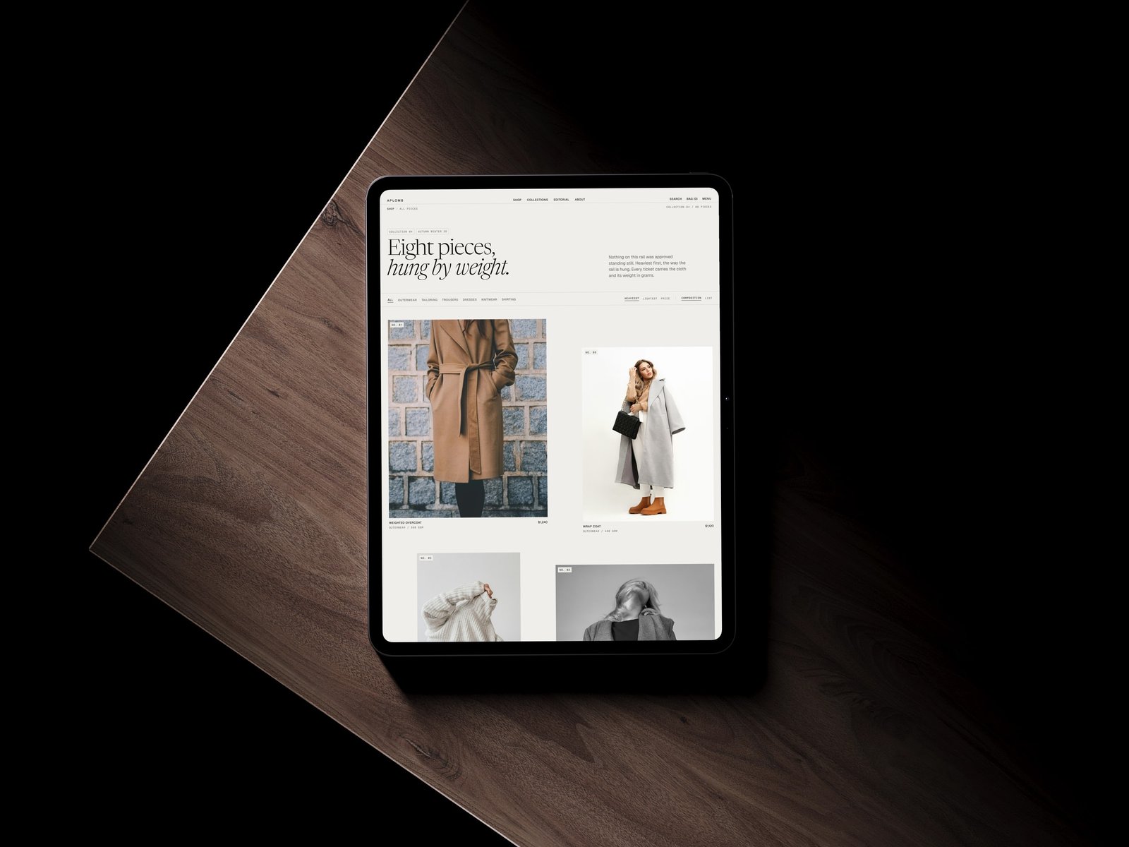 The Aplomb shop on a tablet lying on dark wood, headed Eight pieces, hung by weight