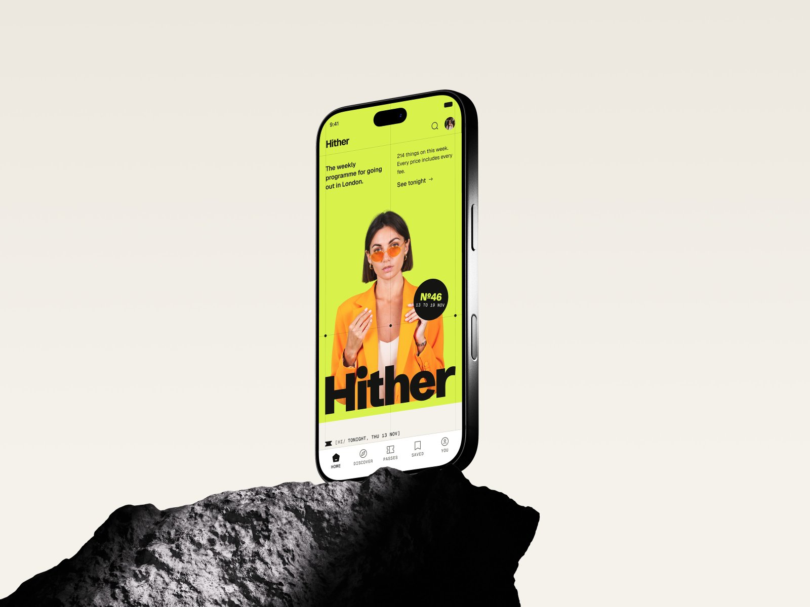 The Hither home page on a phone, standing on a rock