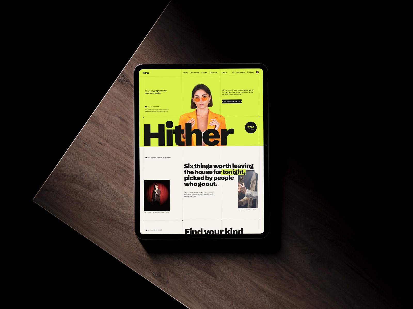 The Hither home page on a tablet lying on a wooden table